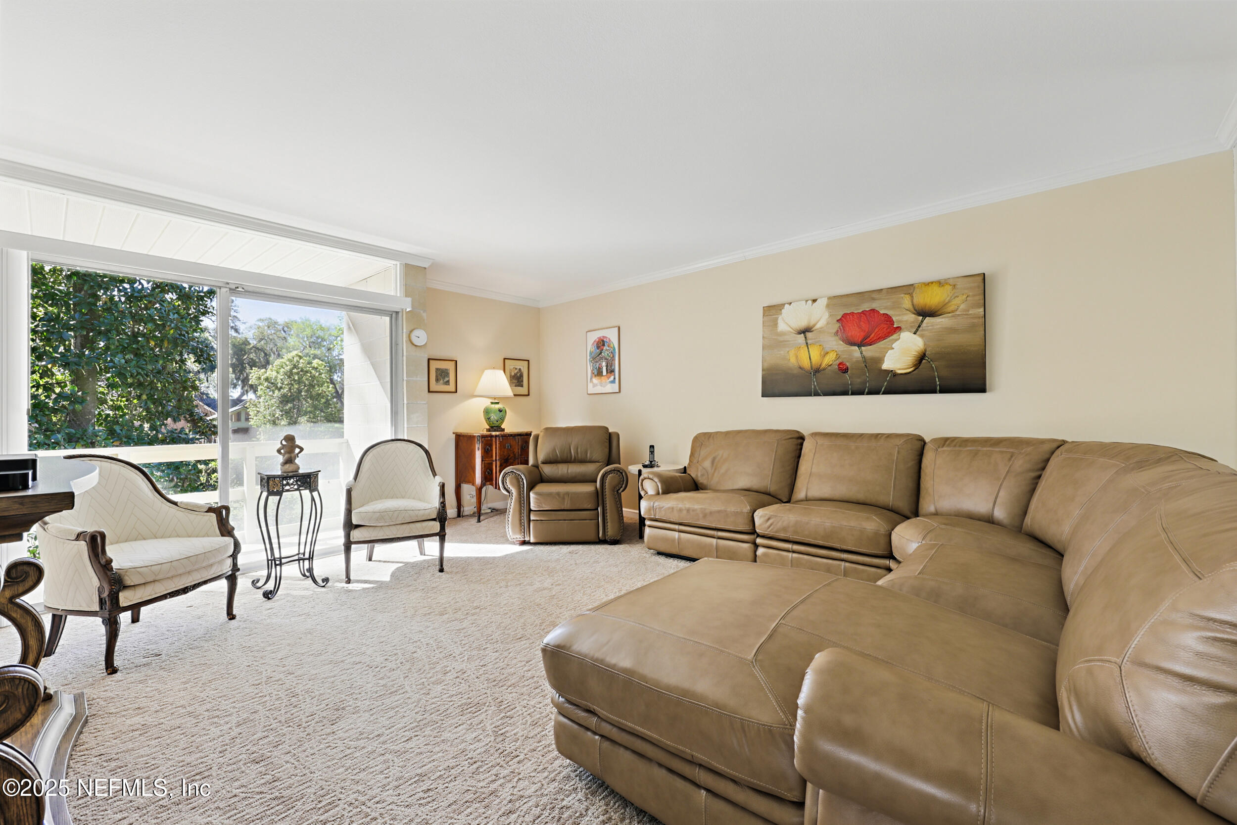 2916 Forest Circle Jacksonville, FL 32257 - Photo 39 of 64 a living room with furniture and a large window