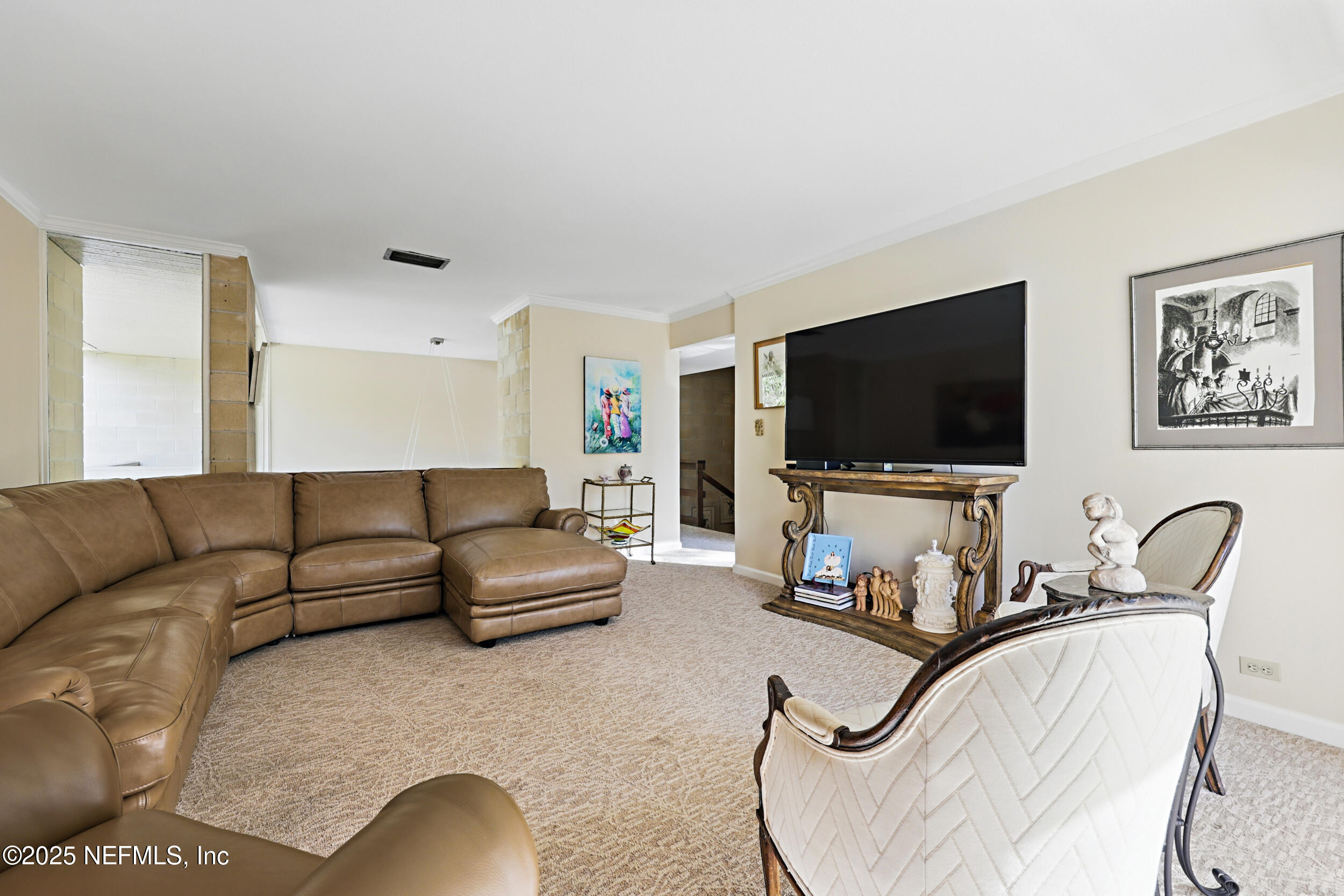 2916 Forest Circle Jacksonville, FL 32257 - Photo 40 of 64 a living room with furniture and a flat screen tv