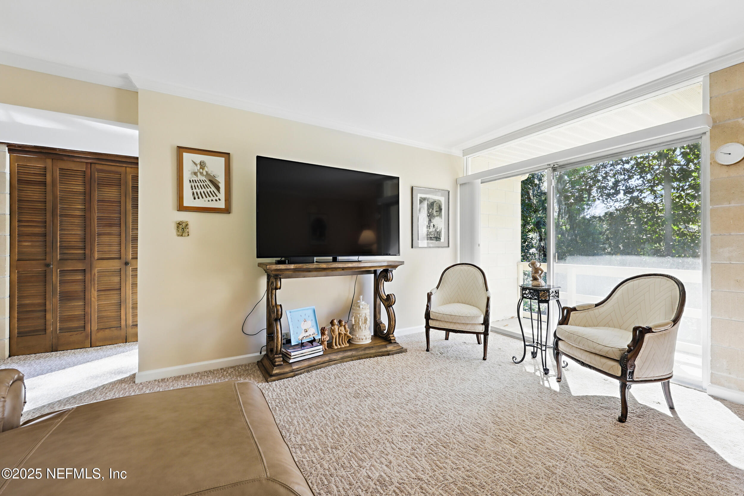 2916 Forest Circle Jacksonville, FL 32257 - Photo 41 of 64 a living room with furniture and a flat screen tv