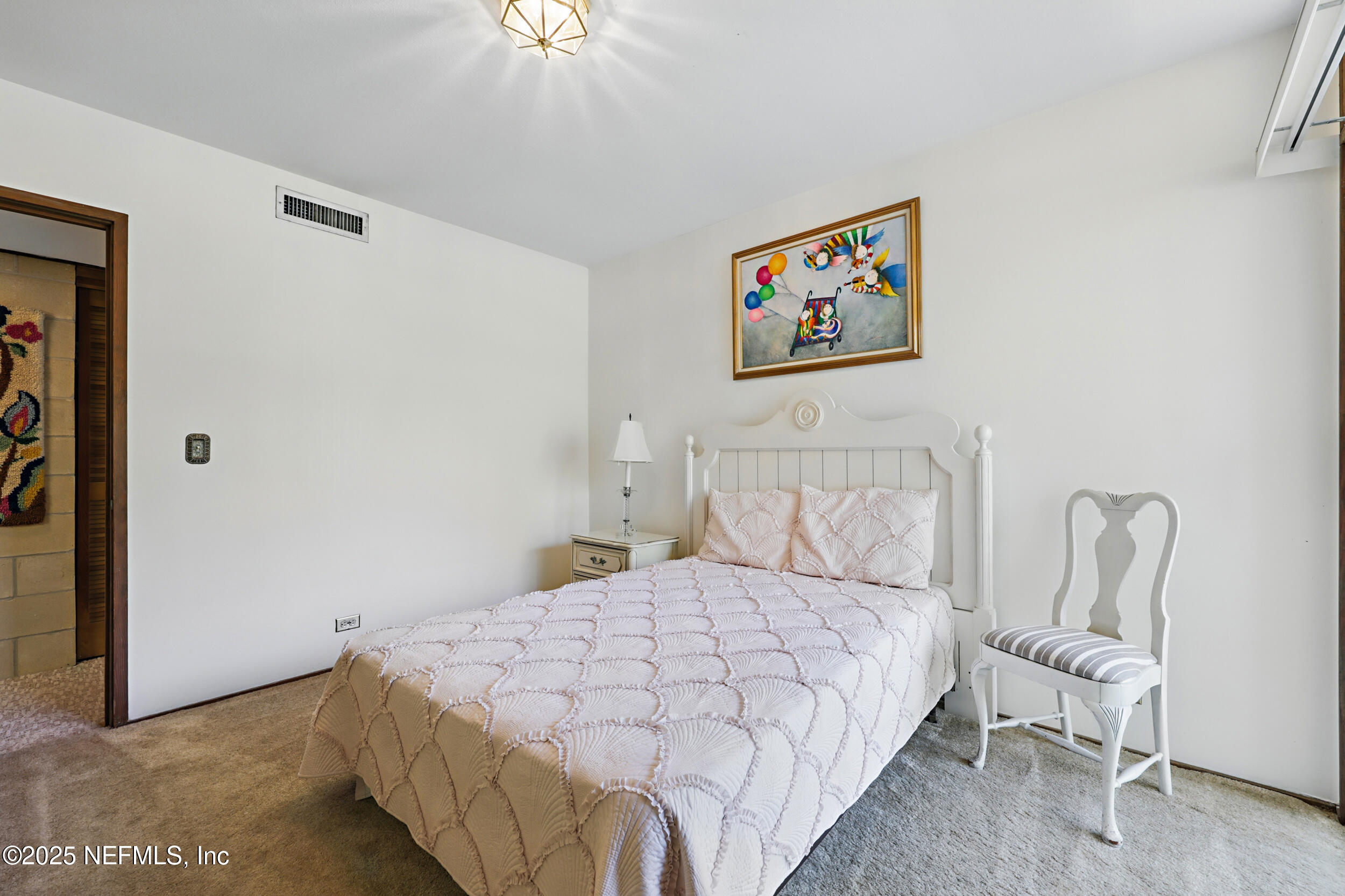 2916 Forest Circle Jacksonville, FL 32257 - Photo 43 of 64 a bedroom with a bed and a painting on the wall