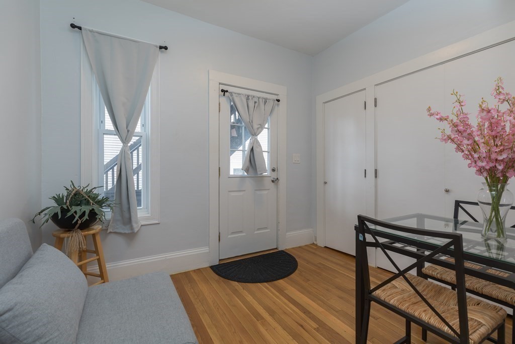 4 Cross Street, Unit 1 Malden, MA 02148 - Photo 11 of 17 a bedroom with a bed and a potted plant