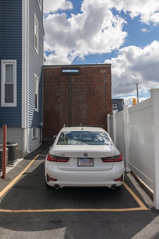 4 Cross Street, Unit 1 Malden, MA 02148 - Photo 15 of 17 a car parked in front of a building