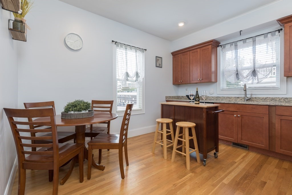 4 Cross Street, Unit 1 Malden, MA 02148 - Photo 3 of 17 a view of a dining room with furniture and a window