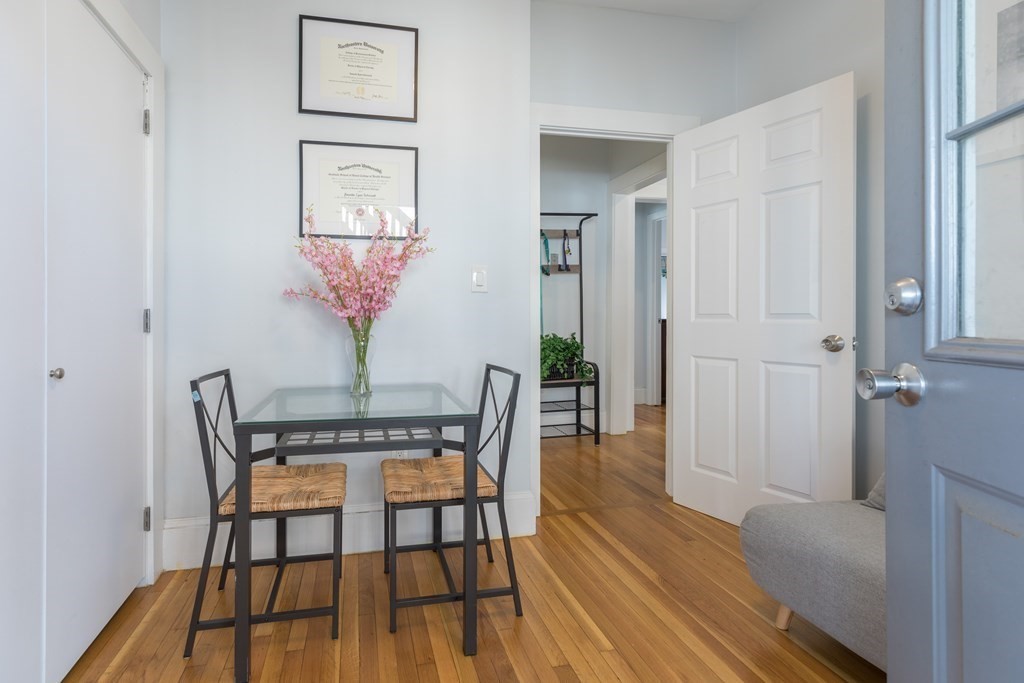 4 Cross Street, Unit 1 Malden, MA 02148 - Photo 10 of 17 a view of a dining room with furniture and wooden floor
