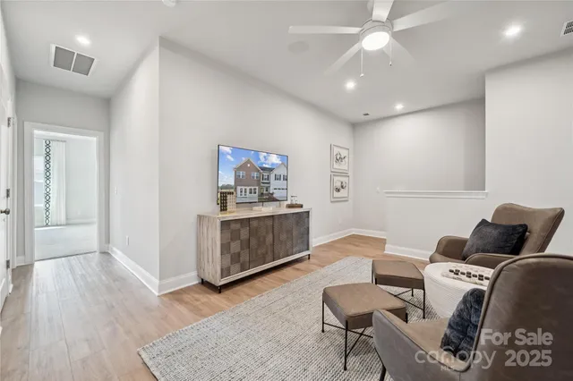 a view of gallery with wooden floor