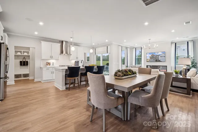 a view of a swimming pool with outdoor seating