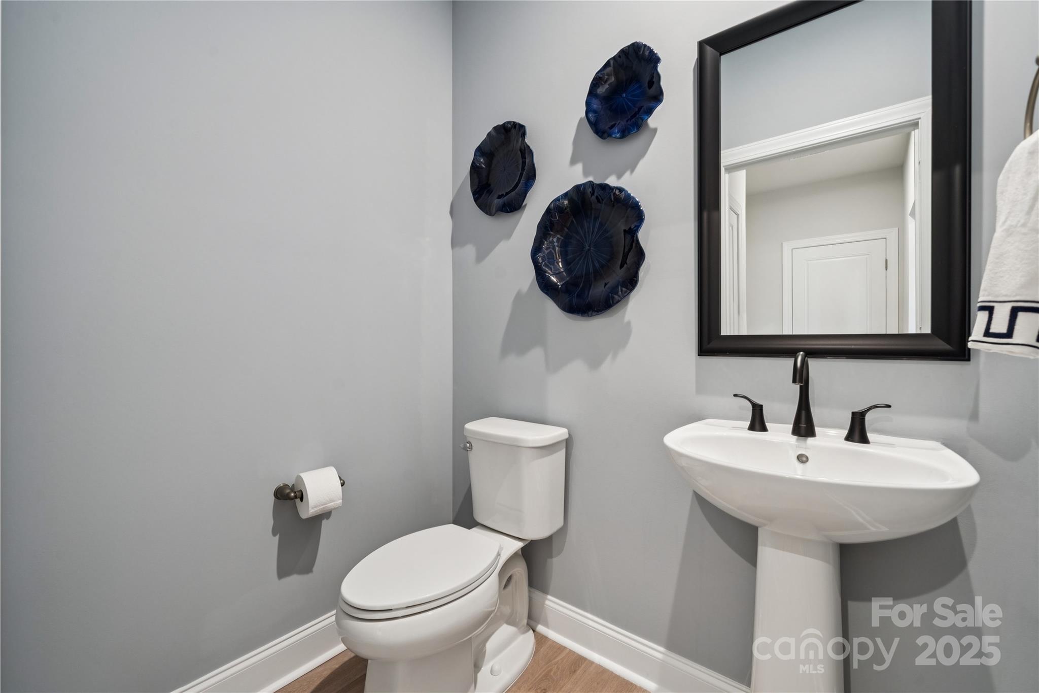 1285 Margo Mannor None Fort Mill Fort Mill, SC 29708 - Photo 23 of 33 a bathroom with a toilet sink and mirror