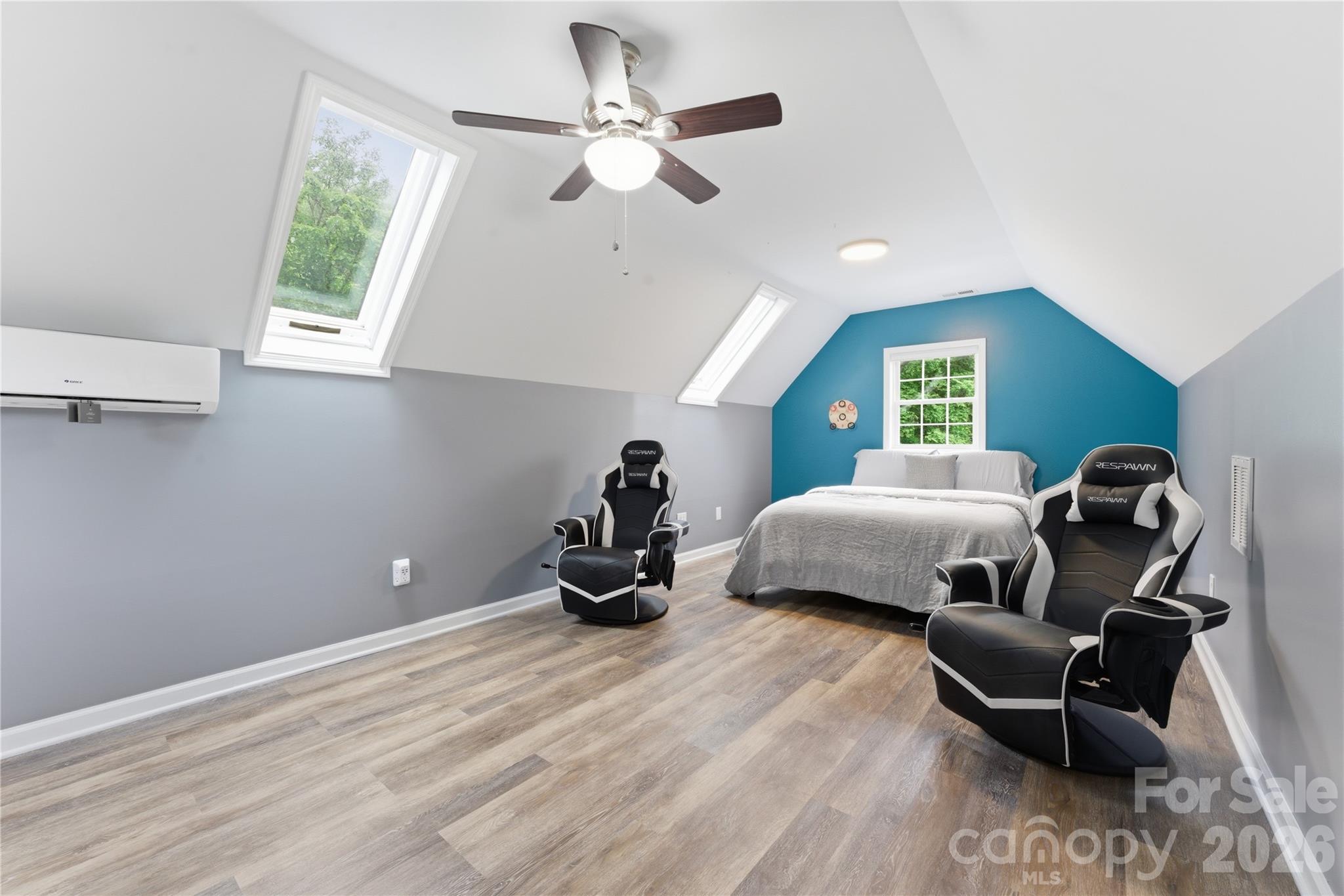 15 Raccoon Point Canton, NC 28716 - Photo 33 of 48 a bedroom with a bed and a chandelier