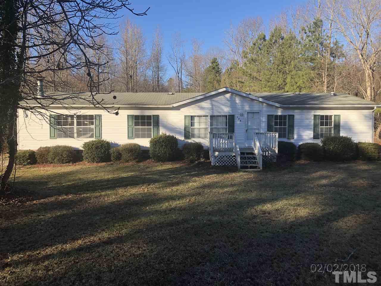170 Beaver Dam Road Henderson, NC 27537 - Photo 1 of 8 a view of a house with backyard and garden