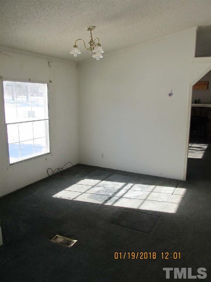 170 Beaver Dam Road Henderson, NC 27537 - Photo 4 of 8 a view of an empty room and window