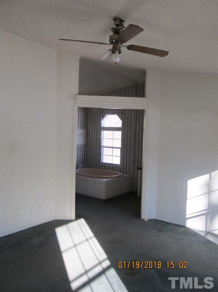 170 Beaver Dam Road Henderson, NC 27537 - Photo 6 of 8 a living room with a couch