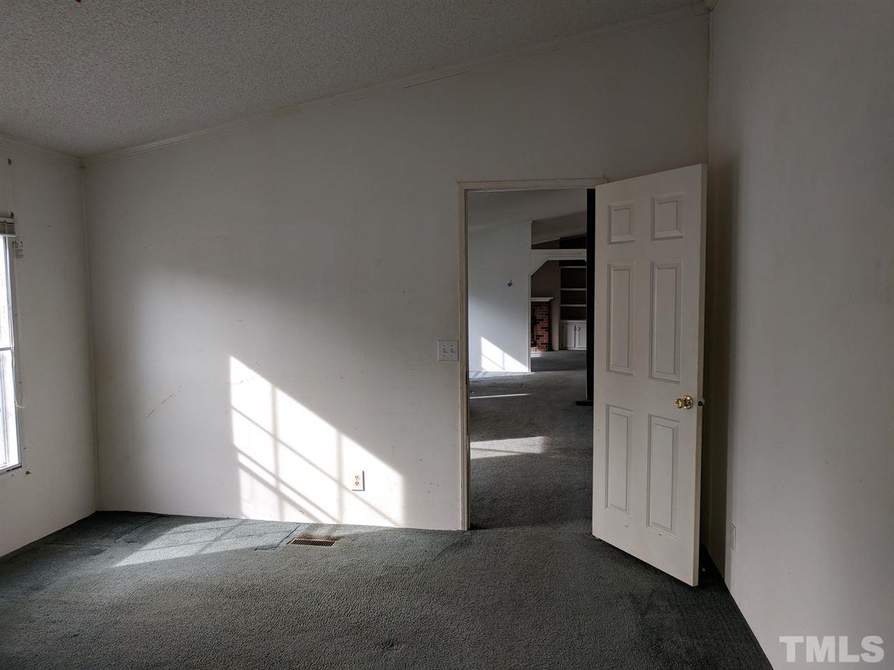 170 Beaver Dam Road Henderson, NC 27537 - Photo 8 of 8 an empty room with windows and closet