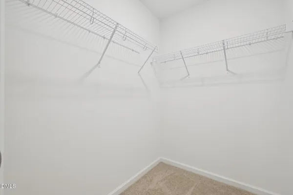 a view of a small space with wooden floor