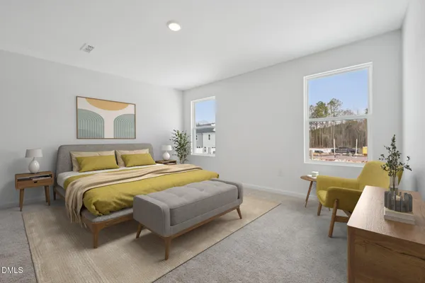 a bedroom with a bed and a couch