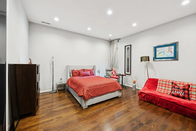 a living room with furniture a piano and a window