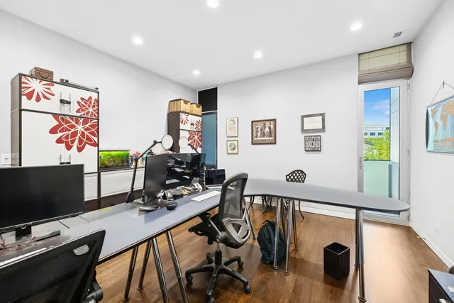 a bathroom with a toilet sink vanity tub and shower