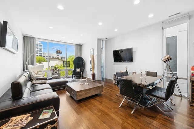 a living room with fireplace furniture and a flat screen tv