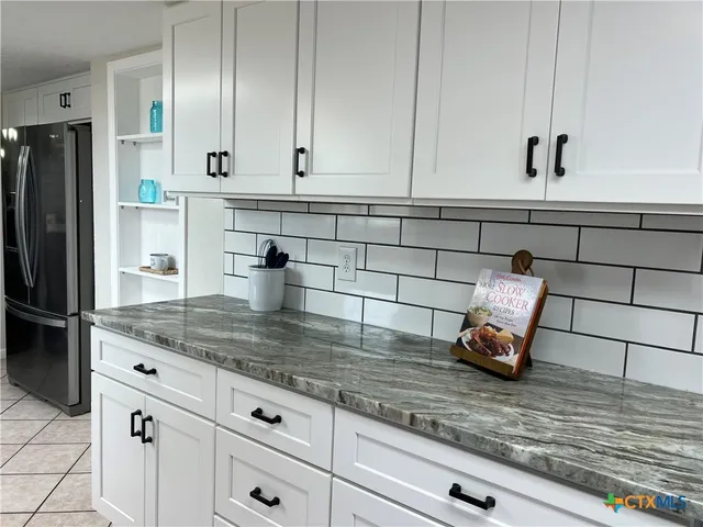 a bedroom with furniture and a chandelier