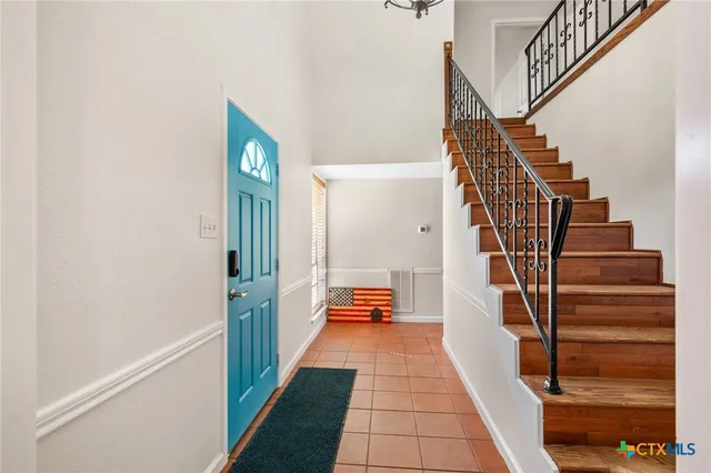 a bedroom with a bed and a closet