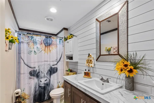 a bedroom with bed and a window