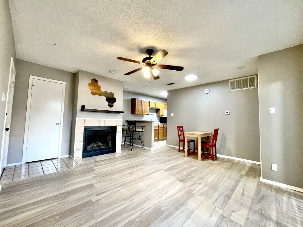 a view of a livingroom with kitchen and furniture