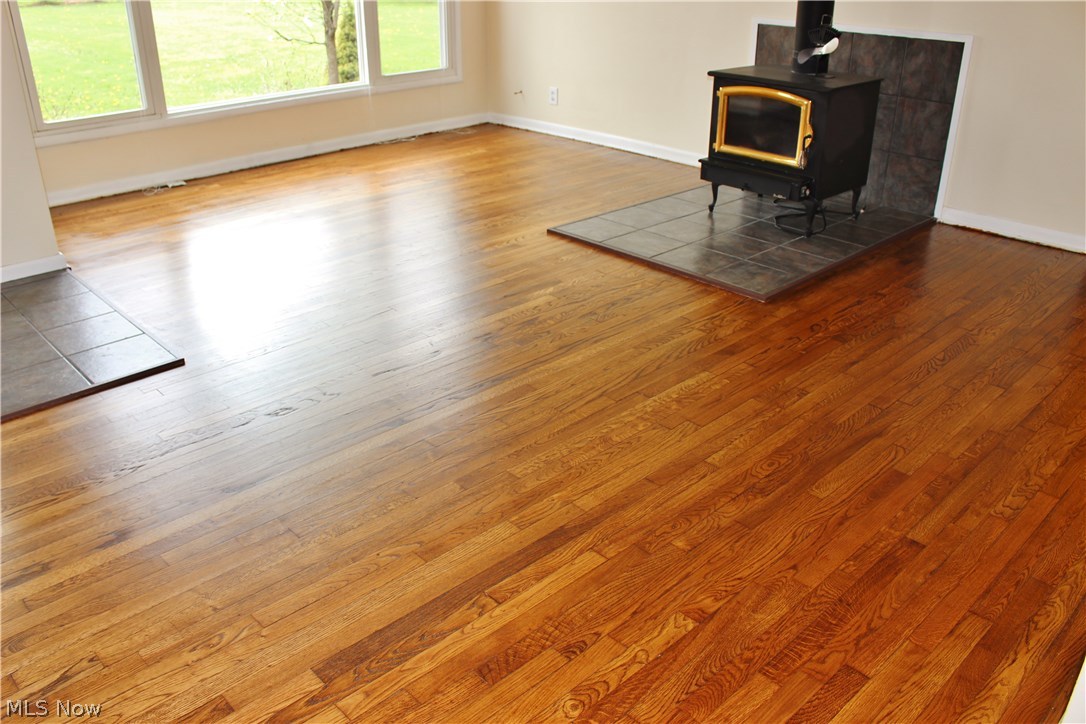 10702 Chillicothe Road Kirtland, OH 44094 - Photo 8 of 25 Gleaming newly finished hardwood floor in the Living Room.
