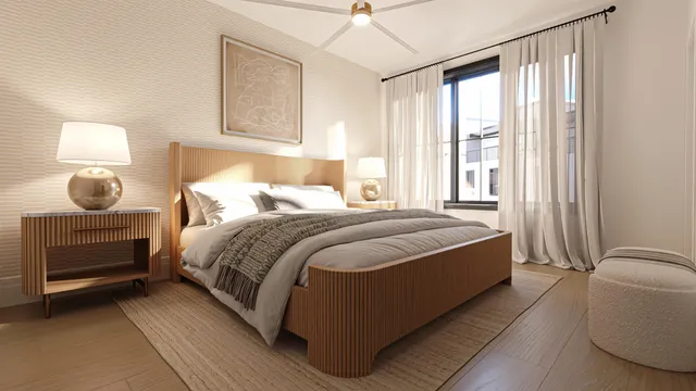 a bedroom with a bed lamp and window