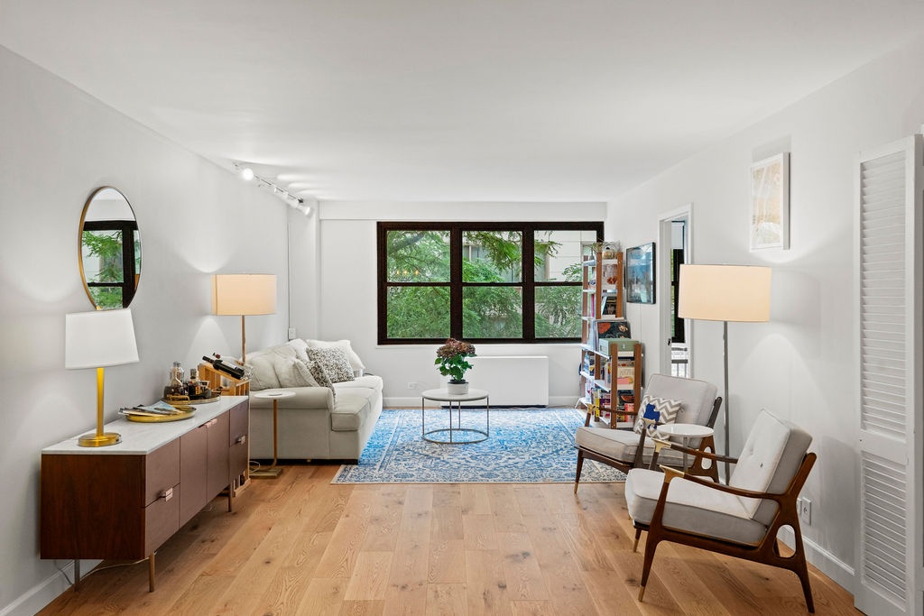 a living room with furniture and a window