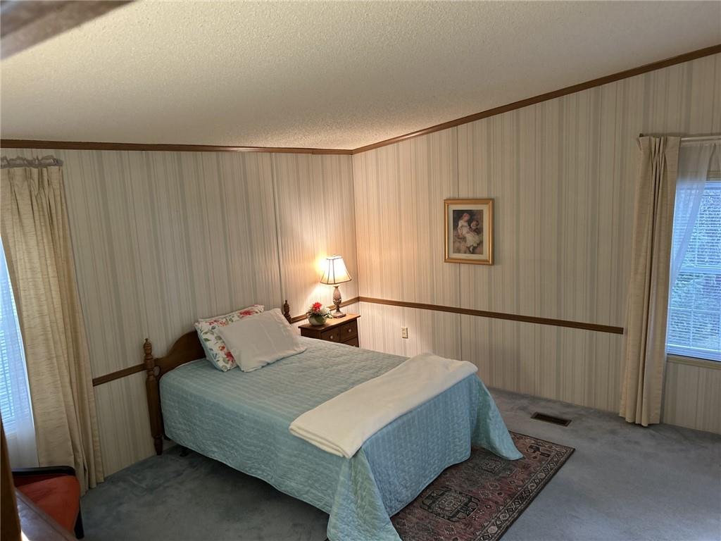 269 Ridge Lane Murrysville, PA 15668 - Photo 17 of 32 a bedroom with a bed and window