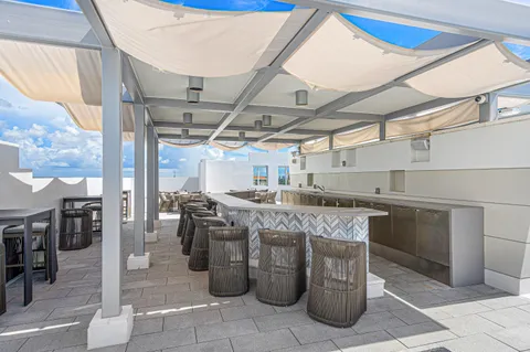 a view of a swimming pool and a yard