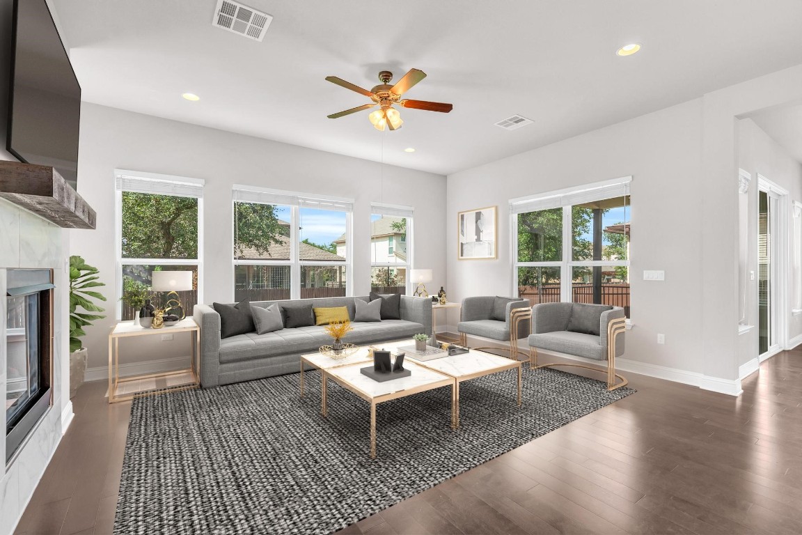 6716 Vitruvius Drive Austin, TX 78739 - Photo 1 of 1 a living room with furniture large window and a flat screen tv