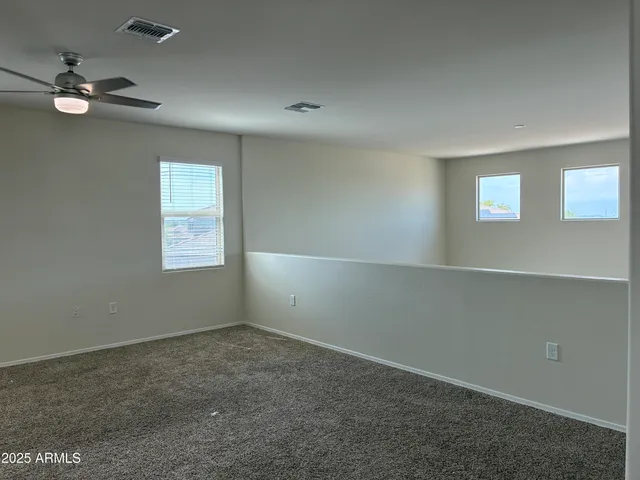 an empty room with a empty space and a window