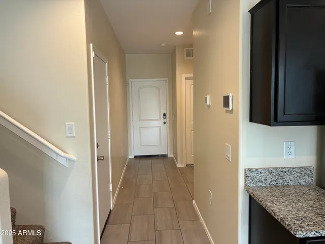 a view of a bathroom from a hallway