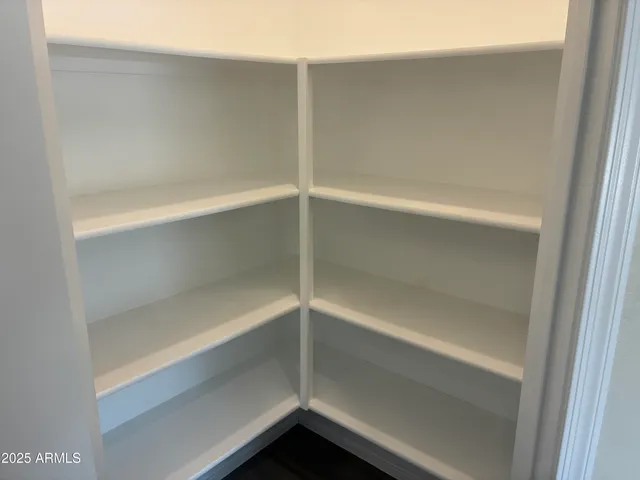 a empty closet with white paint