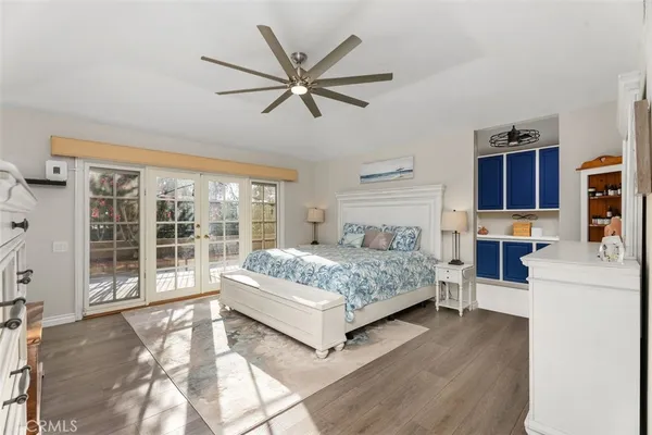a bedroom with a large bed and a large window