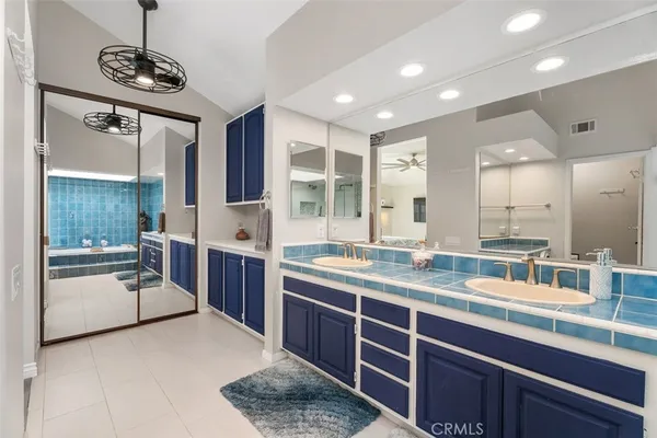 a kitchen with stainless steel appliances granite countertop a sink and stove