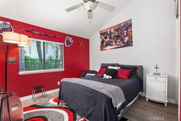 a bed room with a bed and a chandelier
