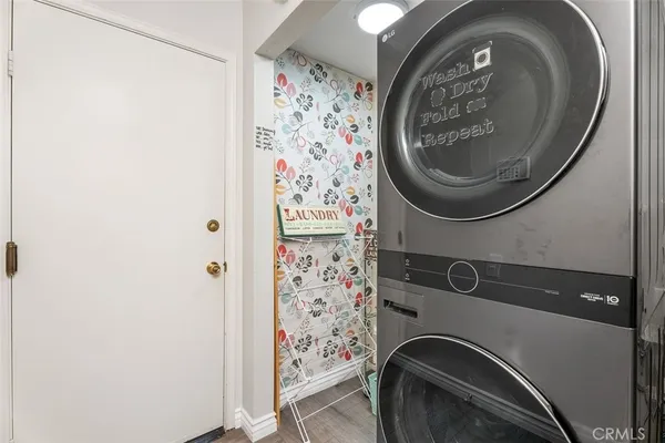 a close view of a utility room with dryer and washer