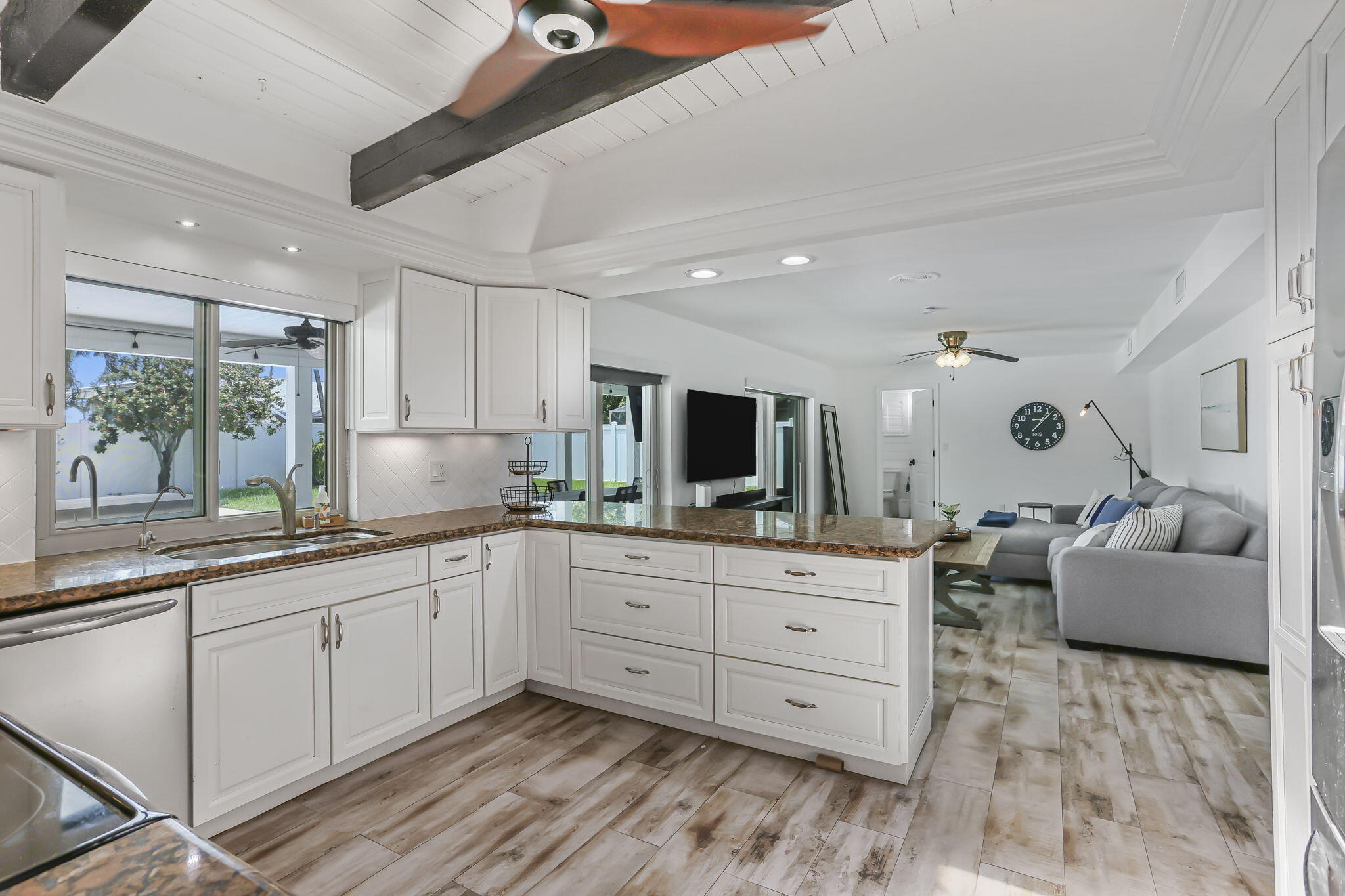 1260 Northwest 15th Street Boca Raton, FL 33486 - Photo 16 of 52 a large white kitchen with a large window