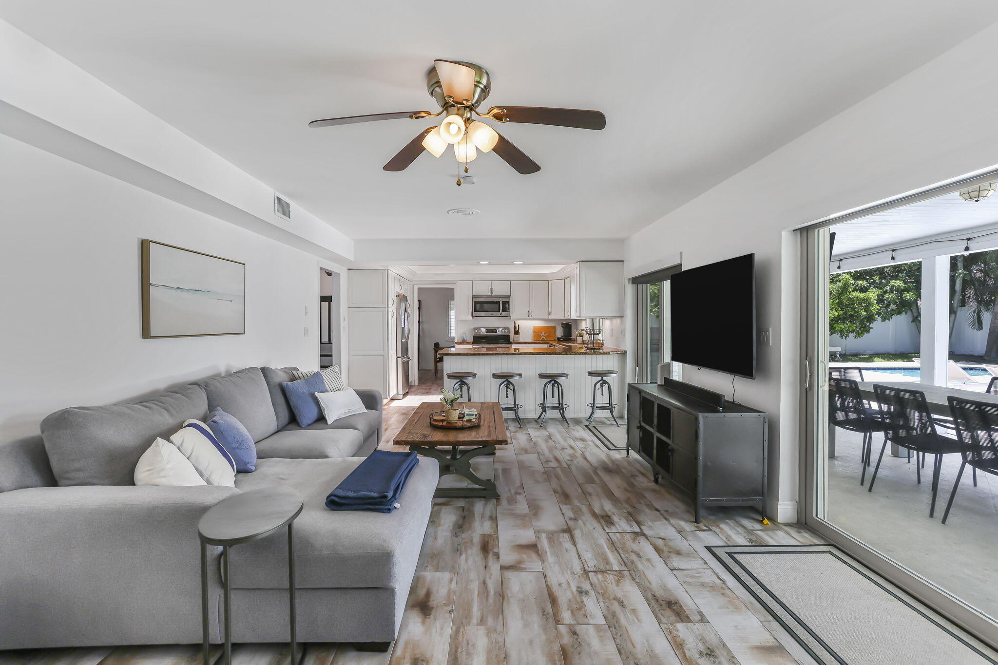 1260 Northwest 15th Street Boca Raton, FL 33486 - Photo 18 of 52 a living room with furniture and a flat screen tv
