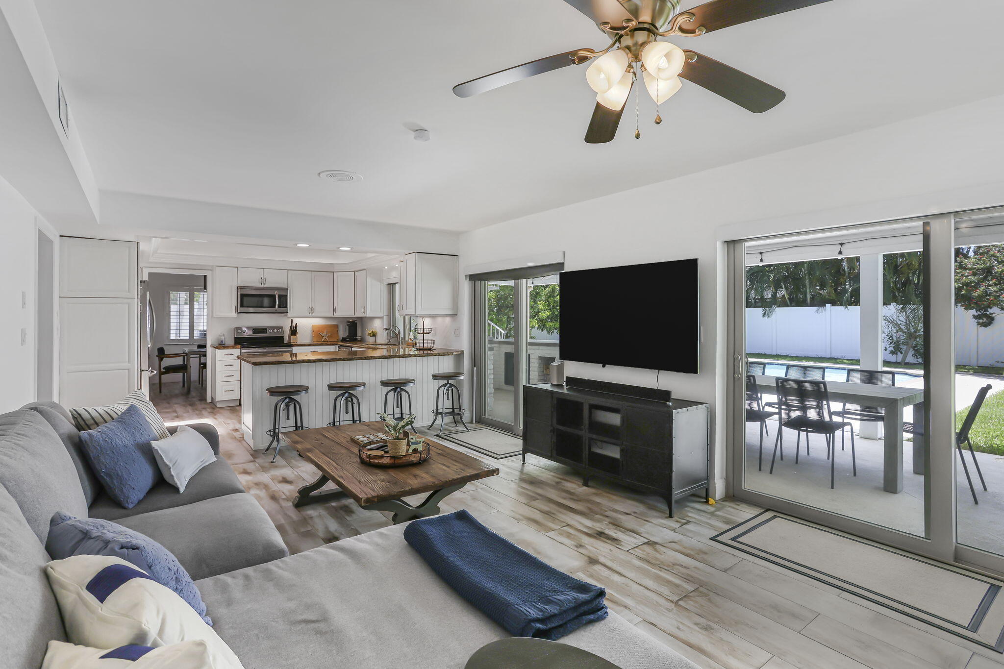 1260 Northwest 15th Street Boca Raton, FL 33486 - Photo 19 of 52 a living room with furniture and a flat screen tv