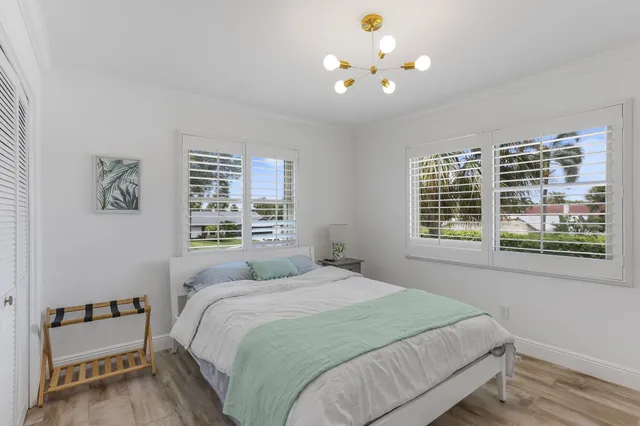 a kitchen with kitchen island stainless steel appliances a stove a sink and a refrigerator