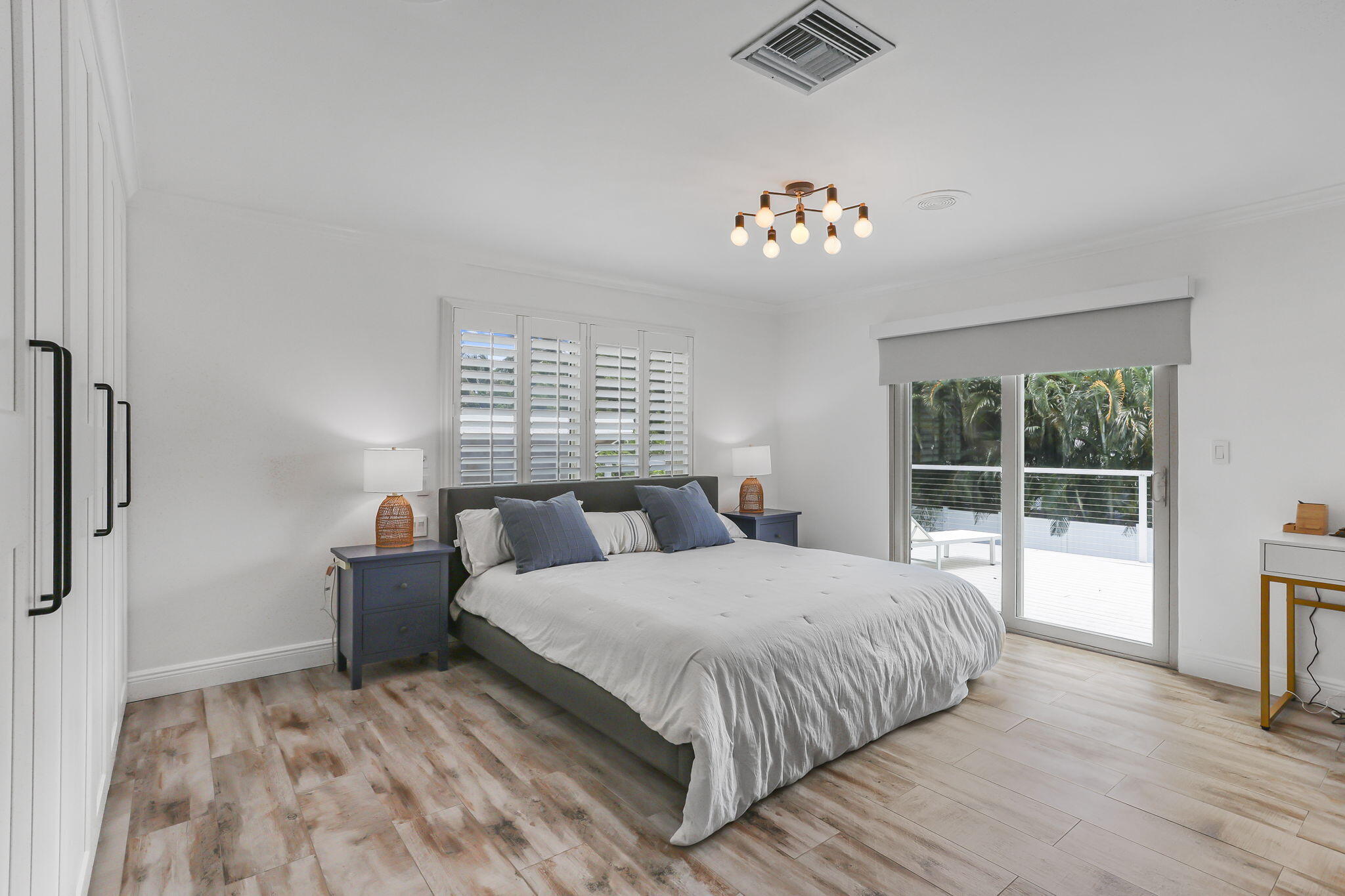 1260 Northwest 15th Street Boca Raton, FL 33486 - Photo 27 of 52 a bedroom with a large bed and a window