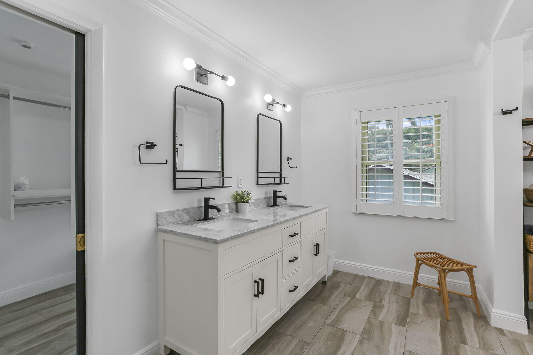 1260 Northwest 15th Street Boca Raton, FL 33486 - Photo 30 of 52 a bathroom with a double vanity sink and a mirror