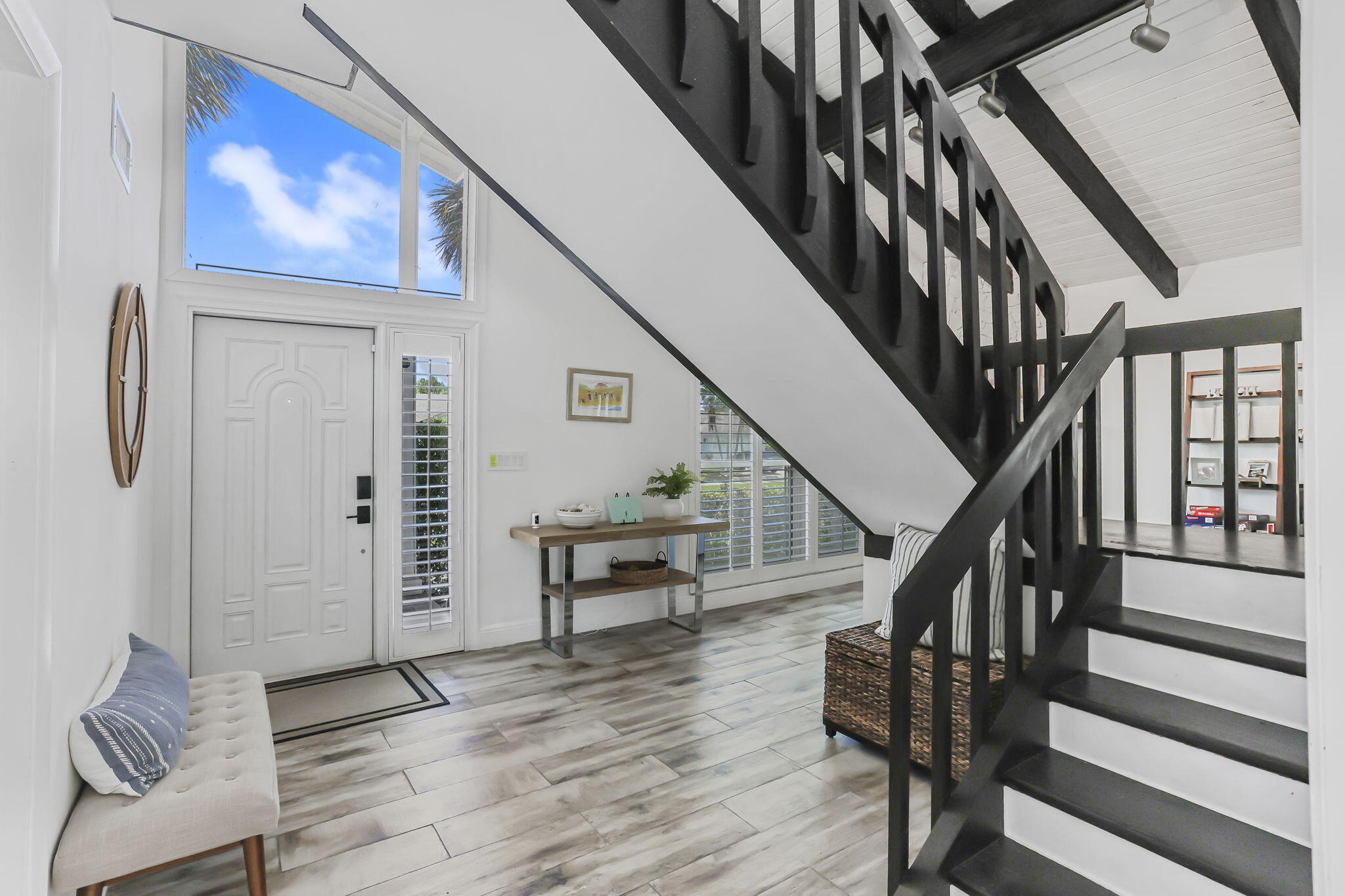 1260 Northwest 15th Street Boca Raton, FL 33486 - Photo 5 of 52 a view of entryway and hall with wooden floor