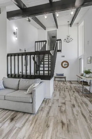 a large kitchen with granite countertop lots of counter top space and stainless steel appliances