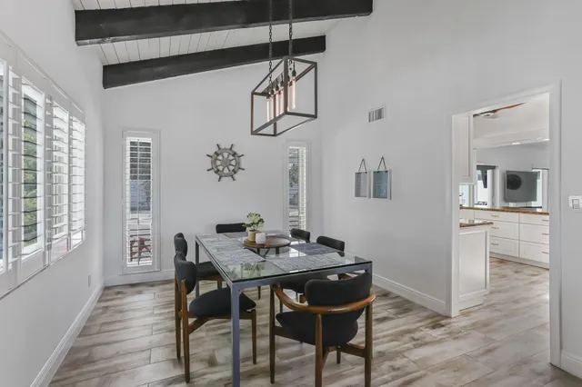a kitchen with granite countertop cabinets stainless steel appliances and a sink