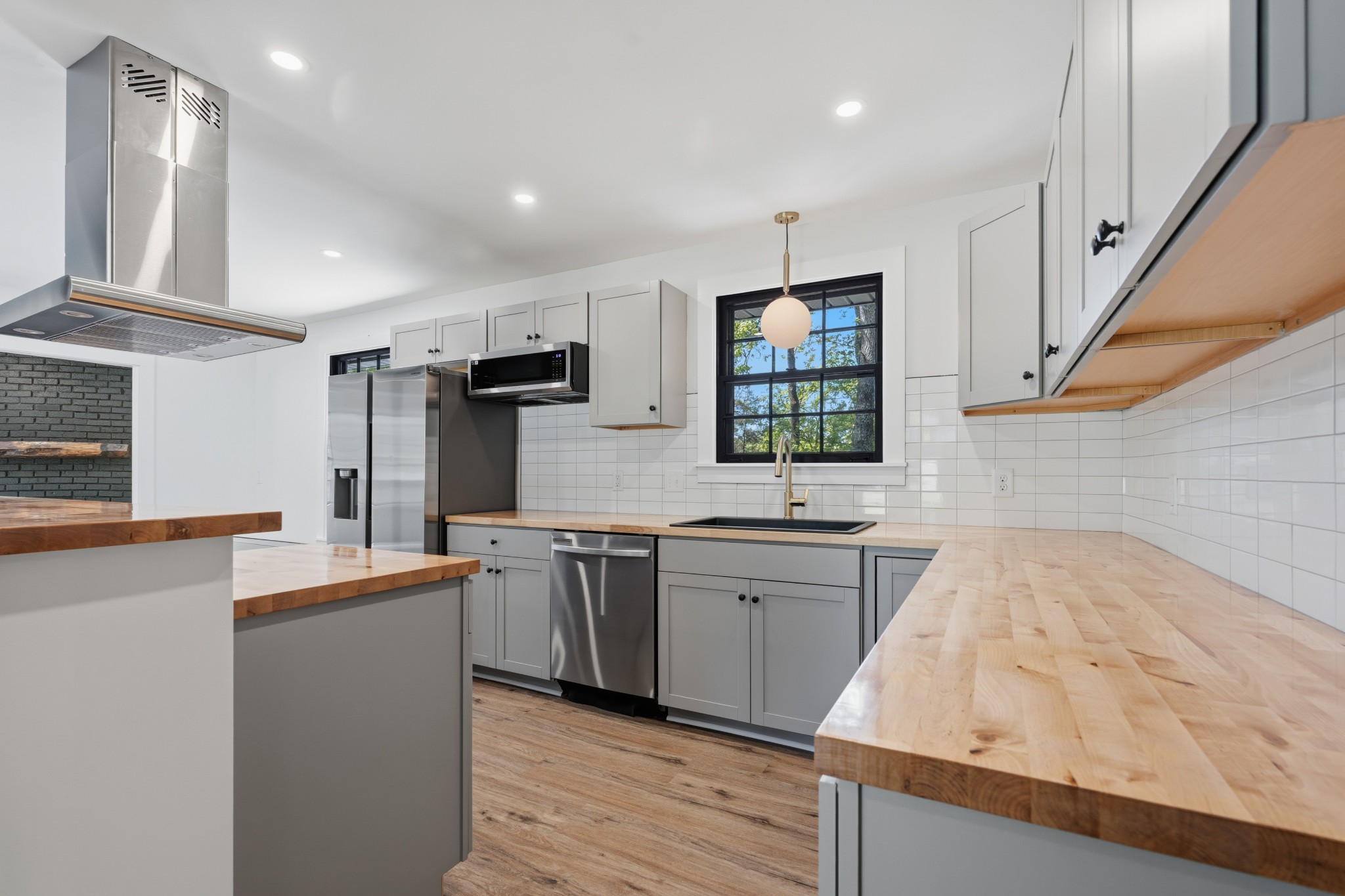 616 Baton Rouge Court Hermitage, TN 37076 - Photo 14 of 43 a large kitchen with stainless steel appliances granite countertop a sink and a stove