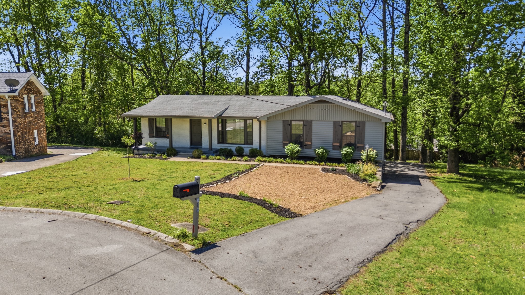 616 Baton Rouge Court Hermitage, TN 37076 - Photo 2 of 43 a swimming pool view with a seating space and a garden