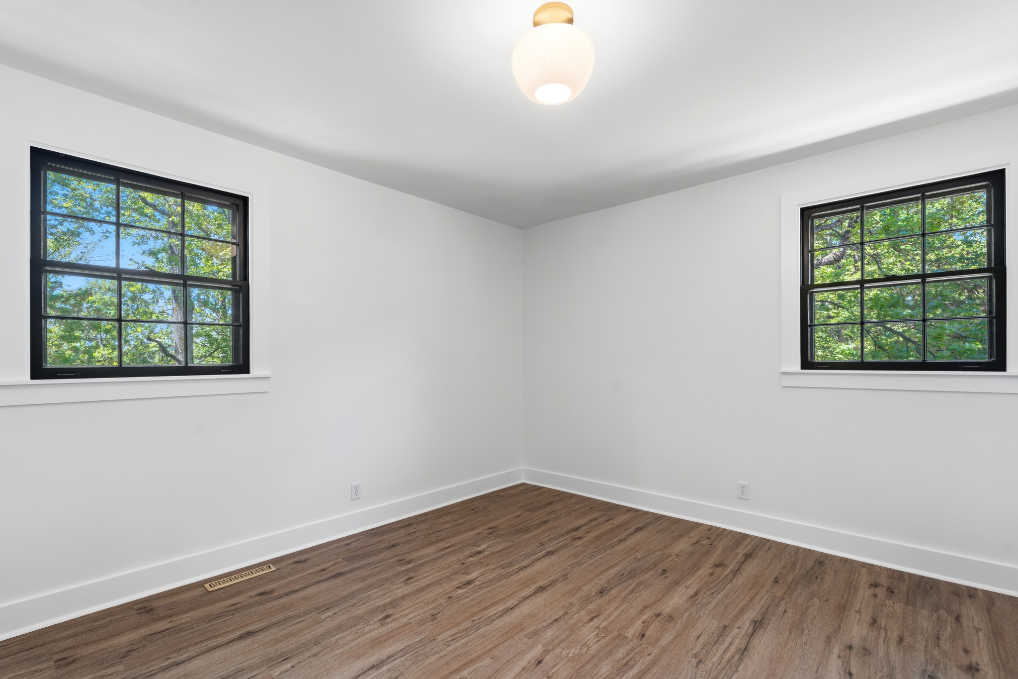 616 Baton Rouge Court Hermitage, TN 37076 - Photo 24 of 43 a view of an empty room with wooden floor and a window